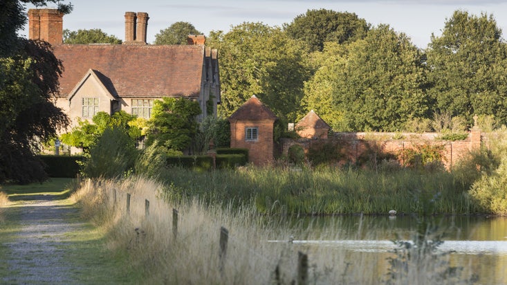 Looking along 'the causeway', the dam of the lake at Packwood House, Warwickshire.